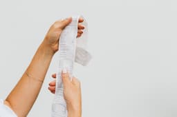 A shopper's receipt, held up for review